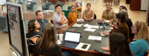 A group of teachers sitting around a table.