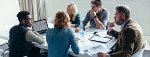A group of professionals sitting at a conference table