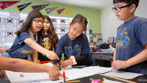 Children work together in a classroom.