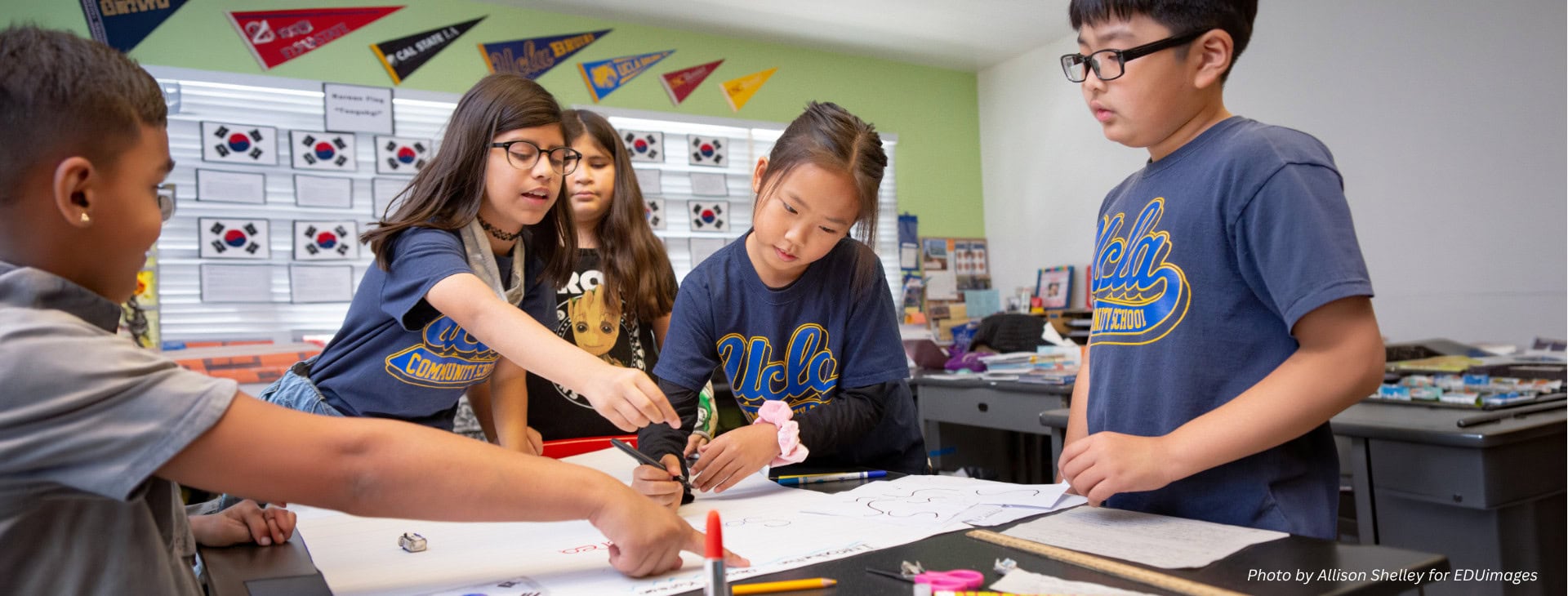 Children work together in a classroom.